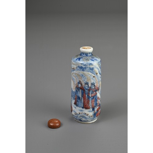 54 - A CHINESE UNDERGLAZE BLUE AND COPPER RED PORCELAIN SNUFF BOTTLE, 19TH CENTURY. Of cylindrical form d... 