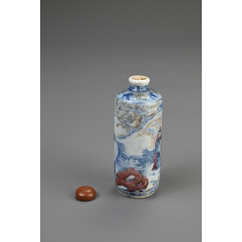 54 - A CHINESE UNDERGLAZE BLUE AND COPPER RED PORCELAIN SNUFF BOTTLE, 19TH CENTURY. Of cylindrical form d... 