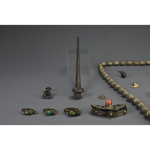 67 - A GROUP OF TURKMAN, TIBETAN, HILL TRIBE ITEMS, 20TH CENTURY. To include an ethnic metalware beaded n... 