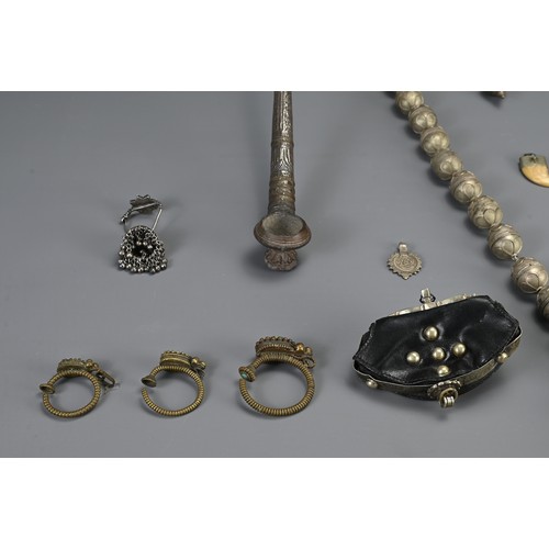 67 - A GROUP OF TURKMAN, TIBETAN, HILL TRIBE ITEMS, 20TH CENTURY. To include an ethnic metalware beaded n... 