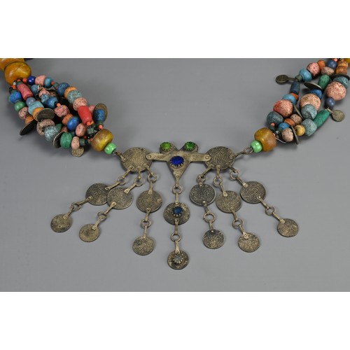 68 - A LARGE MOROCCAN BERBER NECKLACE, 20TH CENTURY. Strung with various coloured ceramic and glass beads... 