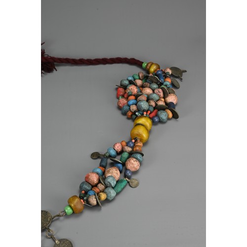 68 - A LARGE MOROCCAN BERBER NECKLACE, 20TH CENTURY. Strung with various coloured ceramic and glass beads... 