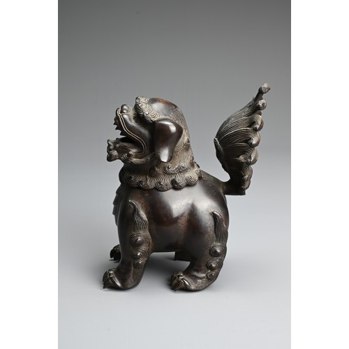 81 - A CHINESE BRONZE BUDDHISTIC LION CENSER, 19/20TH CENTURY. Stood four square with a tall busy tail an... 