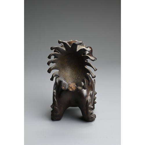 81 - A CHINESE BRONZE BUDDHISTIC LION CENSER, 19/20TH CENTURY. Stood four square with a tall busy tail an... 