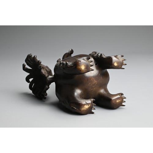 81 - A CHINESE BRONZE BUDDHISTIC LION CENSER, 19/20TH CENTURY. Stood four square with a tall busy tail an... 