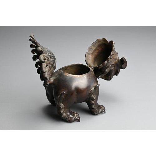 81 - A CHINESE BRONZE BUDDHISTIC LION CENSER, 19/20TH CENTURY. Stood four square with a tall busy tail an... 