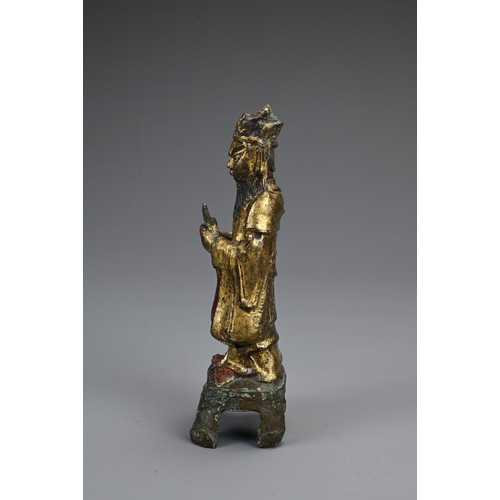 77 - A CHINESE GILT AND LACQUERED BRONZE FIGURE OF DEITY, LATE MING DYNASTY. The figure dressed in robes ... 