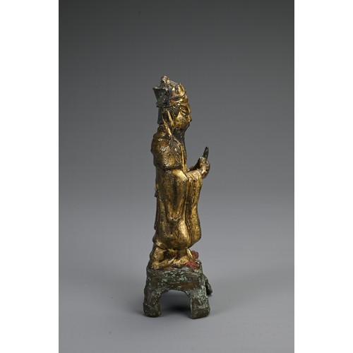 77 - A CHINESE GILT AND LACQUERED BRONZE FIGURE OF DEITY, LATE MING DYNASTY. The figure dressed in robes ... 