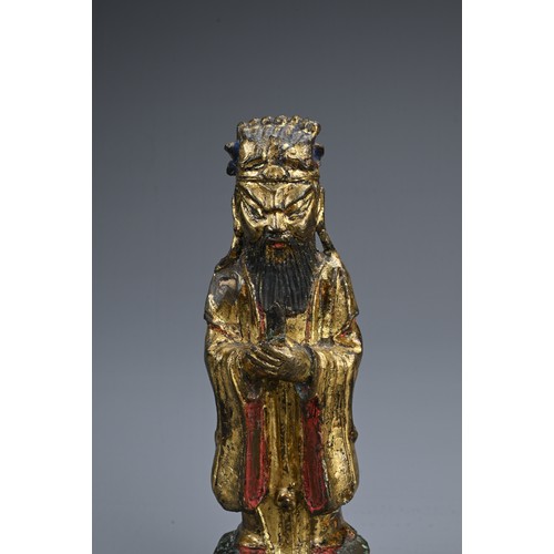 77 - A CHINESE GILT AND LACQUERED BRONZE FIGURE OF DEITY, LATE MING DYNASTY. The figure dressed in robes ... 