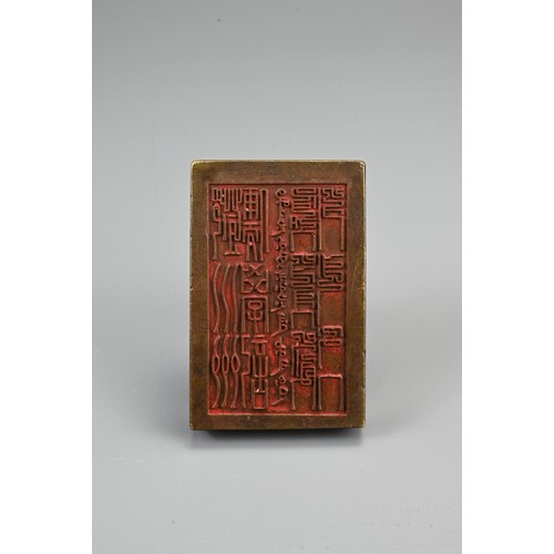 84 - A CHINESE BRONZE SCHOLARS SEAL, GUANGXU MARKED. Of rectangular form with cylindrical handle. Incised... 