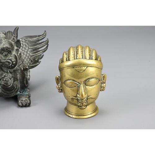 74 - A GROUP OF INDIAN / ASIAN METAL WARE ITEMS, 20TH CENTURY. To include a bronze model of a head; A bro... 