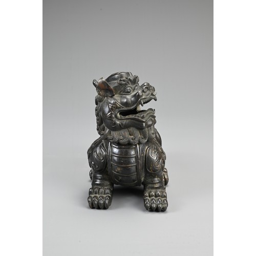 80 - A CHINESE BRONZE BUDDHISTIC LION CENSER, 19/20TH CENTURY. The lion seated four square with its hinge... 