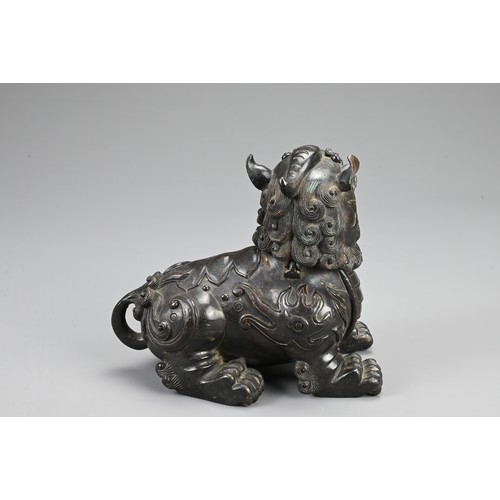 80 - A CHINESE BRONZE BUDDHISTIC LION CENSER, 19/20TH CENTURY. The lion seated four square with its hinge... 