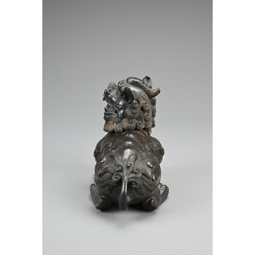 80 - A CHINESE BRONZE BUDDHISTIC LION CENSER, 19/20TH CENTURY. The lion seated four square with its hinge... 