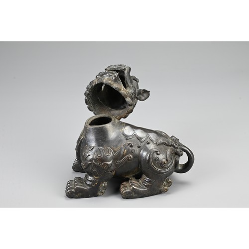 80 - A CHINESE BRONZE BUDDHISTIC LION CENSER, 19/20TH CENTURY. The lion seated four square with its hinge... 