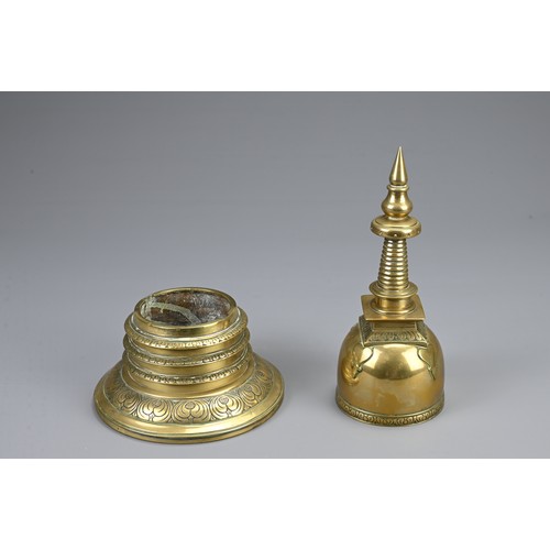 79 - A SOUTHEAST ASIAN POLISHED BRONZE STUPA, CIRCA 1900. In two sections decorated with lappets and flor... 