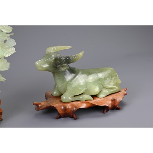 362 - A CHINESE CARVED JADE MODEL OF A RECUMBENT WATER BUFFALO WITH SERPENTINE CARVING, 20TH CENTURY. The ... 