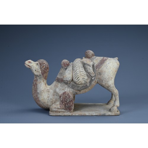 178 - A CHINESE PAINTED POTTERY FIGURE OF A KNEELING BACTRIAN CAMEL, PROBABLY TANG DYNASTY. With saddle an... 