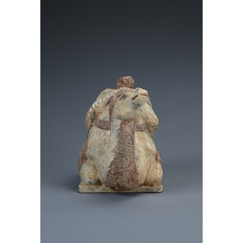 178 - A CHINESE PAINTED POTTERY FIGURE OF A KNEELING BACTRIAN CAMEL, PROBABLY TANG DYNASTY. With saddle an... 