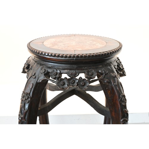 200 - A TALL CHINESE HARDWOOD AND RED MARBLE JARDINIÈRE STAND, 19TH CENTURY. Circular top with pierced fri... 