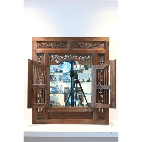 198 - A CARVED AND PIERCED WOOD FRAMED MIRROR, POSSIBLY PERANAKAN, 20TH CENTURY. Of square form with pierc... 