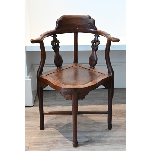 205 - A PAIR OF CHINESE HARDWOOD CORNER CHAIRS, EARLY 20TH CENTURY. A curved top rail on four legs and cro... 