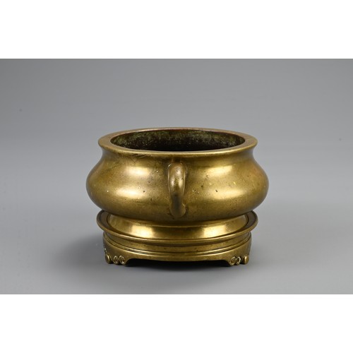 82 - A CHINESE BRONZE CENSER ON STAND, 18/19TH CENTURY. Heavily cast of squat form with twin looped handl... 