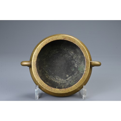 82 - A CHINESE BRONZE CENSER ON STAND, 18/19TH CENTURY. Heavily cast of squat form with twin looped handl... 