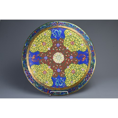 90 - A VERY LARGE CHINESE BRONZE CLOISONNE ENAMEL DRAGON CHARGER, 19/20TH CENTURY. Deep circular dish wit... 