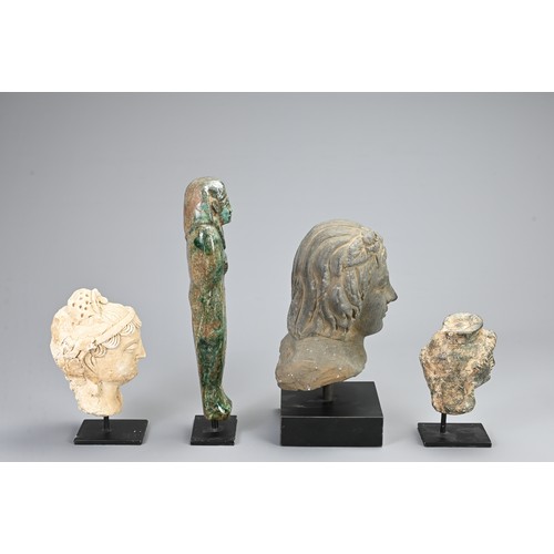 95 - A GROUP OF STONE AND COMPOSITE DECORATIVE ITEMS. To include a green glazed Egyptian Ushabti figure, ... 