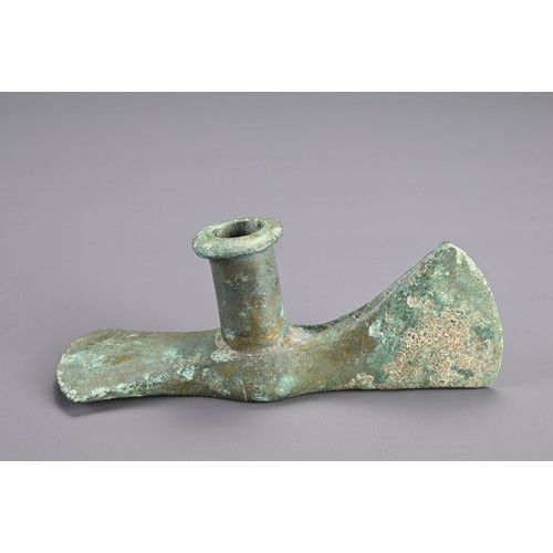 99 - A GROUP OF BRONZE ITEMS, PROBABLY ROMAN AND LATER. To include two axe head fittings, probably Roman;... 