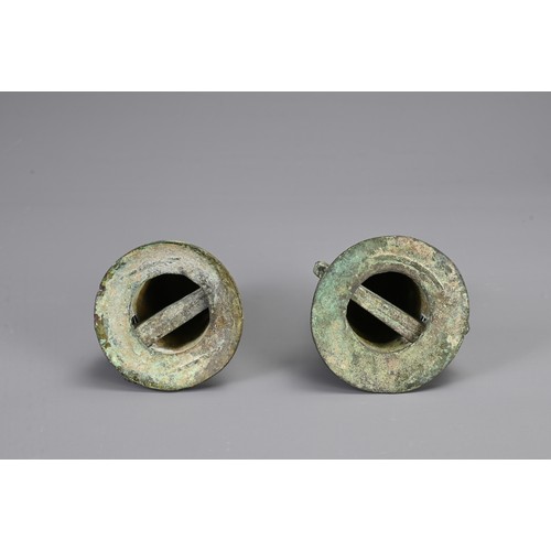 100 - A PAIR OF CHINESE BRONZE CHARIOT AXEL FITTINGS, PROBABLY WARRING STATES / HAN DYNASTY. Each with arc... 