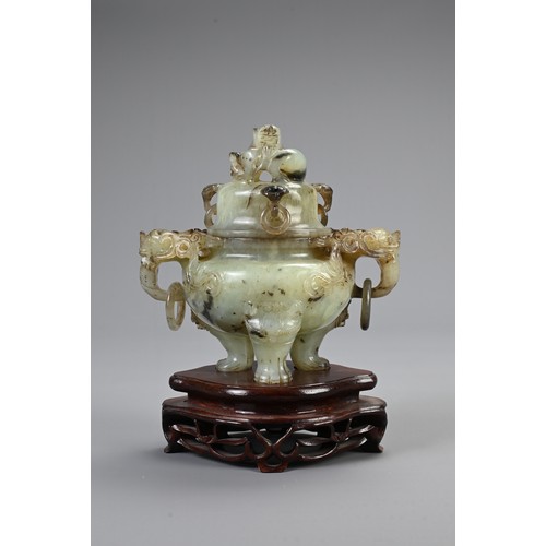 360 - A CHINESE CARVED JADE TRIPOD CENSER, 20TH CENTURY. With animal form ring handles and dragon finial c... 