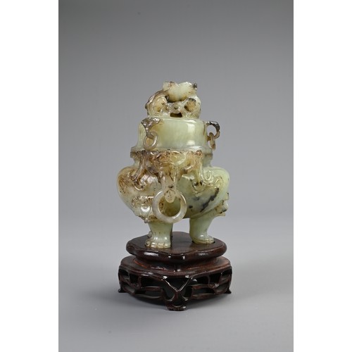 360 - A CHINESE CARVED JADE TRIPOD CENSER, 20TH CENTURY. With animal form ring handles and dragon finial c... 