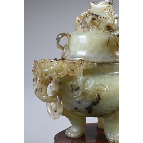 360 - A CHINESE CARVED JADE TRIPOD CENSER, 20TH CENTURY. With animal form ring handles and dragon finial c... 