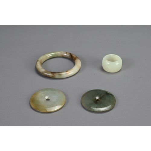 364 - A GROUP OF CHINESE NEPHRITE JADE ITEMS. To include a bangle; A pale celadon jade thumb ring; Togethe... 