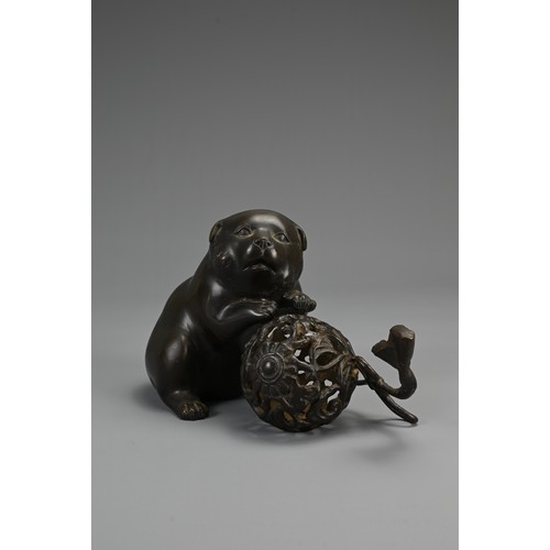 286 - A JAPANESE MEIJI BRONZE PUPPY & BALL, SIGNED YOSHIYAMA, late 19th century, the plump dog depicted wi... 