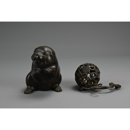 286 - A JAPANESE MEIJI BRONZE PUPPY & BALL, SIGNED YOSHIYAMA, late 19th century, the plump dog depicted wi... 