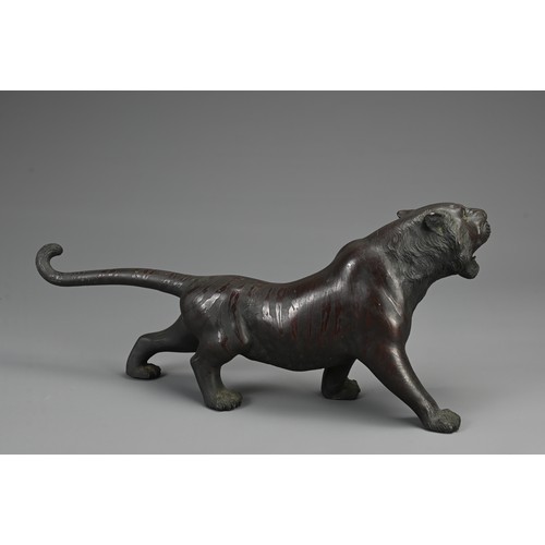 287 - JAPANESE MEIJI PERIOD BRONZE, TIGER OKIMONO BY NYOZAN, late 19th century, with inlaid glass eyes, si... 