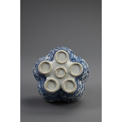 168 - A CHINESE BLUE AND WHITE PORCELAIN TULIP VASE, 19TH CENTURY. Five conjoined vase sections enclosed w... 