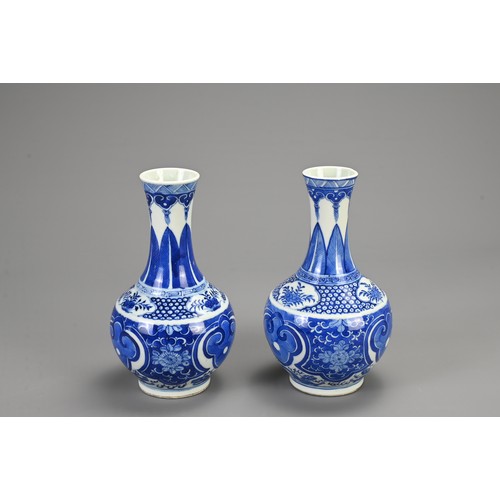 129 - A PAIR OF CHINESE BLUE AND WHITE PORCELAIN VASES, 19/20TH CENTURY. Of baluster form decorated with r... 