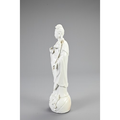 130 - A CHINESE BLANC DE CHINESE PORCELAIN FIGURE OF GUANYIN, 20TH CENTURY. Finely modelled figure dressed... 