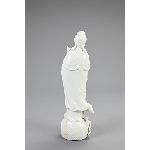 130 - A CHINESE BLANC DE CHINESE PORCELAIN FIGURE OF GUANYIN, 20TH CENTURY. Finely modelled figure dressed... 