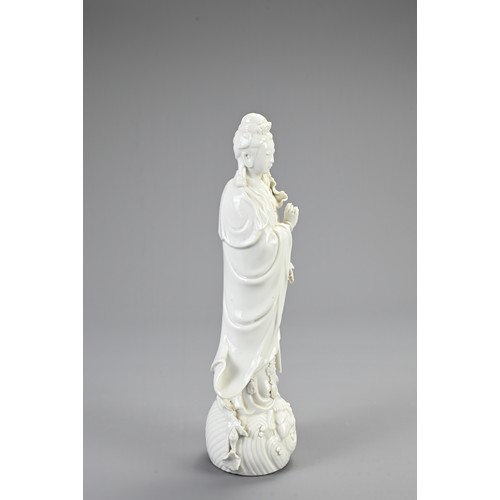 130 - A CHINESE BLANC DE CHINESE PORCELAIN FIGURE OF GUANYIN, 20TH CENTURY. Finely modelled figure dressed... 