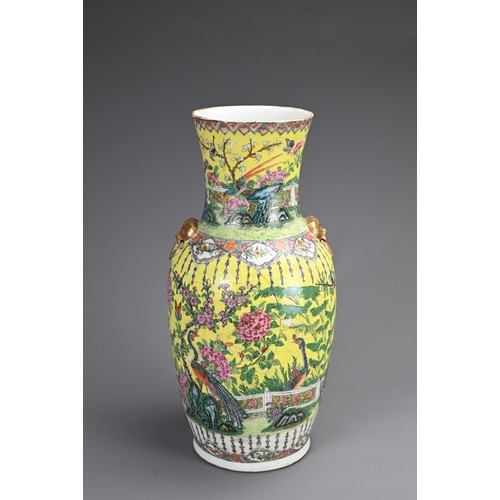 139 - A CHINESE YELLOW GROUND FAMILLE ROSE PORCELAIN VASE, 19TH CENTURY. Of baluster form with gilt lion m... 