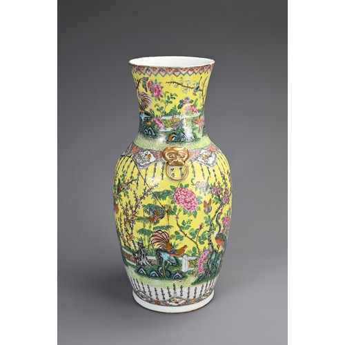 139 - A CHINESE YELLOW GROUND FAMILLE ROSE PORCELAIN VASE, 19TH CENTURY. Of baluster form with gilt lion m... 