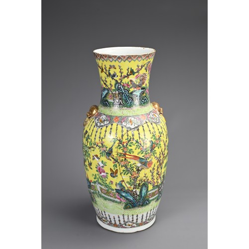 139 - A CHINESE YELLOW GROUND FAMILLE ROSE PORCELAIN VASE, 19TH CENTURY. Of baluster form with gilt lion m... 