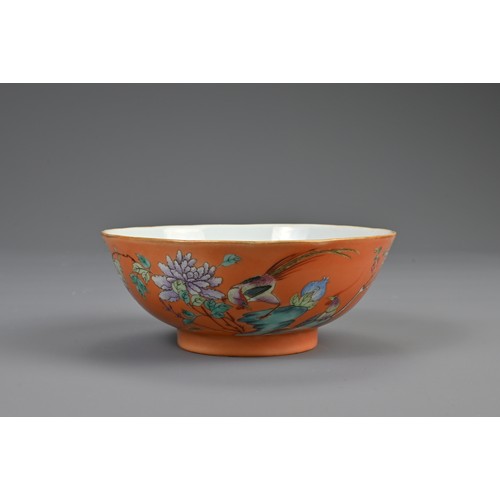 114 - A CHINESE ORANGE GROUND FAMILLE ROSE PORCELAIN BOWL, 19TH CENTURY. Rounded bowl decorated with pheas... 