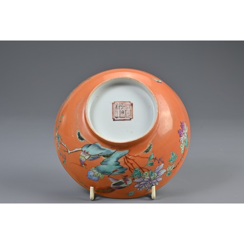 114 - A CHINESE ORANGE GROUND FAMILLE ROSE PORCELAIN BOWL, 19TH CENTURY. Rounded bowl decorated with pheas... 