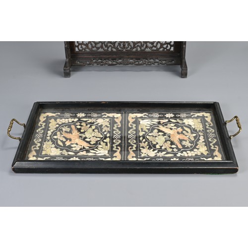 141 - TWO CHINESE WOODEN ITEMS. To include a rectangular tray with silk embroidered panels of birds under ... 